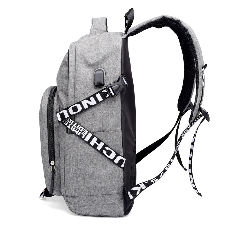 Gray backpack with a black and white strap on a white background.