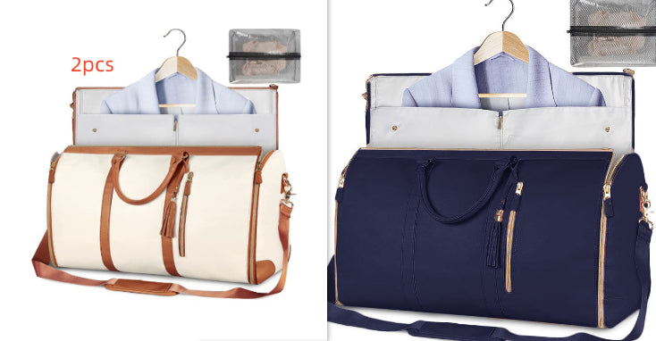 Two bags, one white with brown accents and one navy, on hangers with shirts inside.
