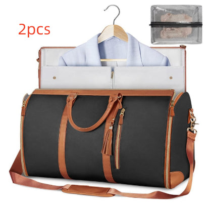 Black and brown travel bag with a shirt on a hanger and a mesh pouch on a white background.