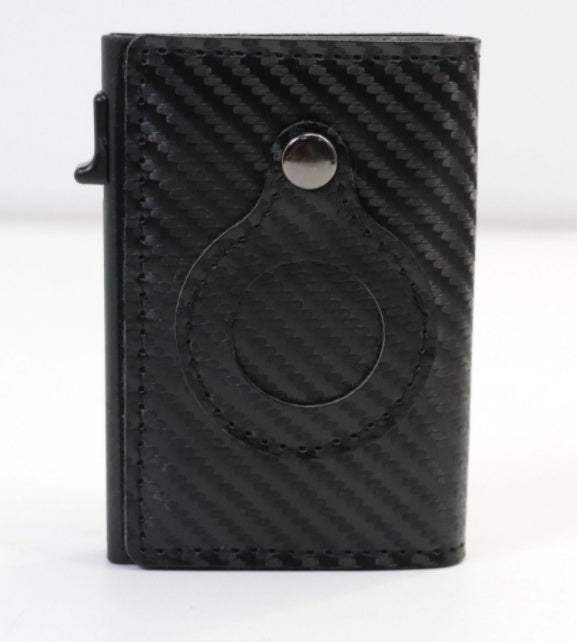 Black cardholder with carbon fiber on white backround.