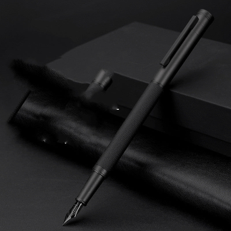 Black fountain pen on a dark surface