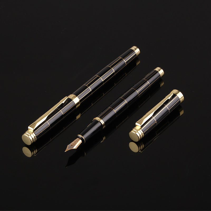 One pen and one fountain pen with gold accents on a black background.