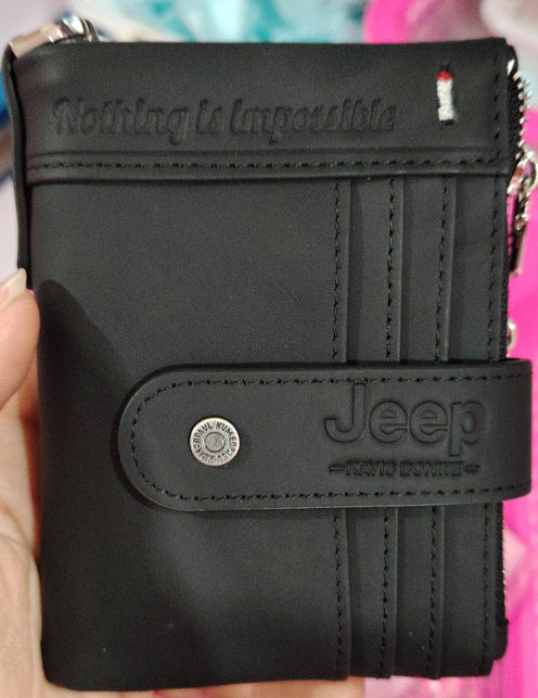 Black Jeep wallet held in a hand with colorful background.