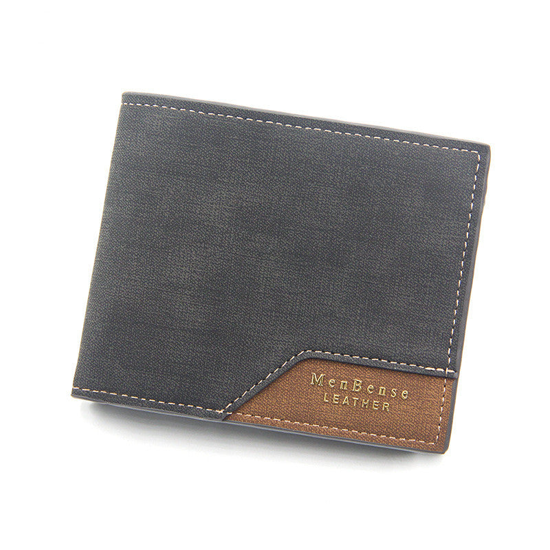Gray leather wallet with brown accent on white background.
