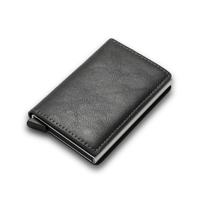 Black smart cardholder with metal clip on white background.