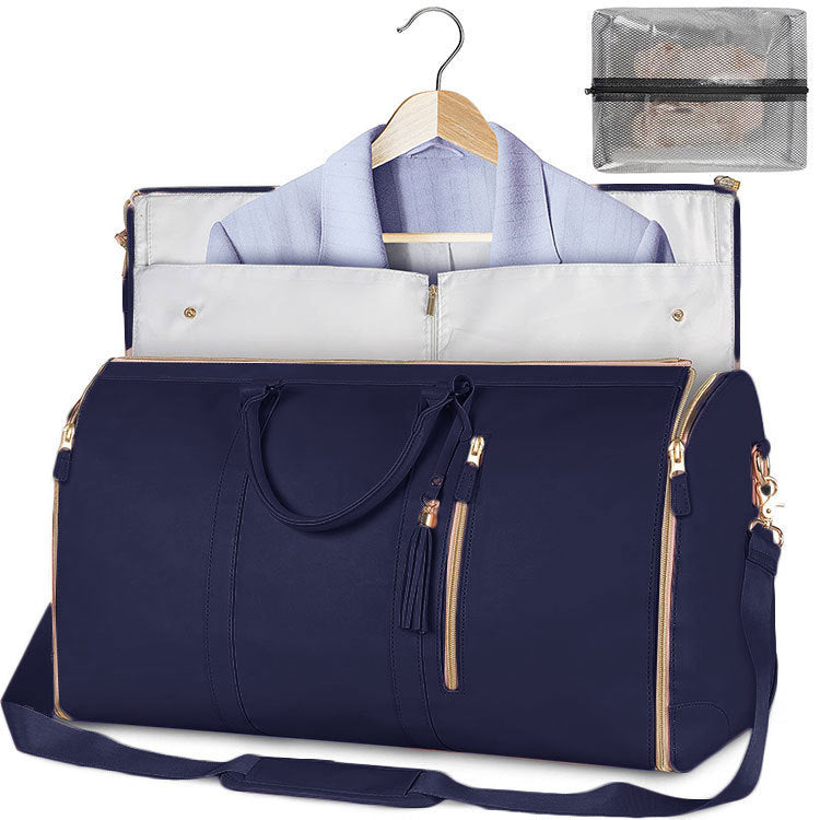 Navy blue travel bag with a white shirt on a hanger and a clear pouch inside.