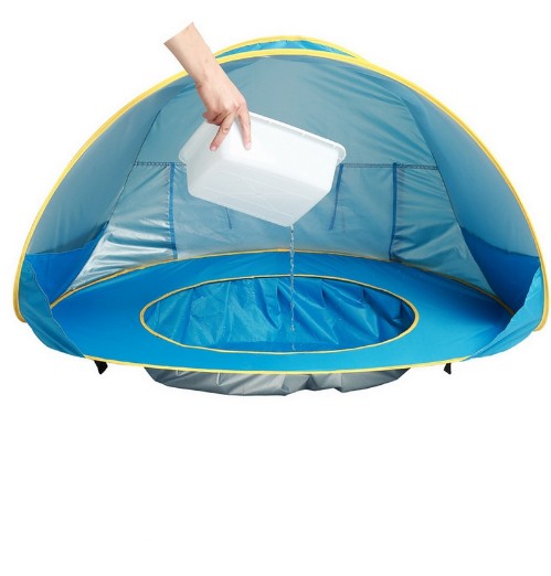 Blue pop-up tent with a hand holding a white container on a white background.