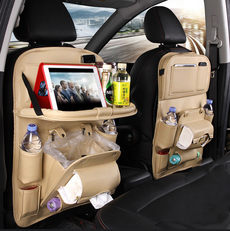 Car back seat organizer with tablet holder, water bottles, and snacks in a vehicle interior.