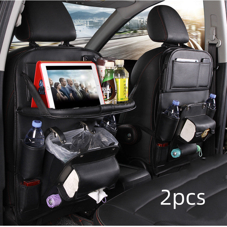 Car back seat organizer with tablet holder, drink holders, and trash bin in a vehicle.