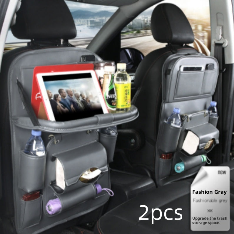 Car back seat organizer with tablet stand and trash can in a vehicle interior.