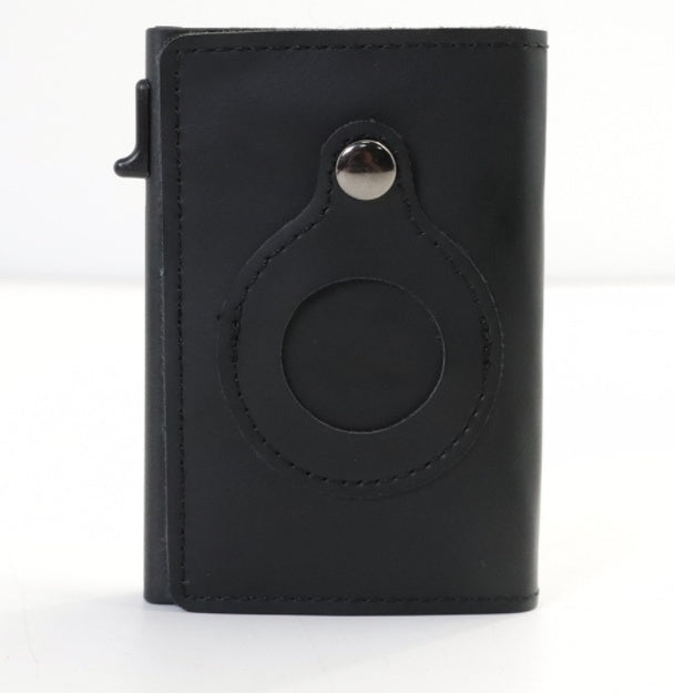 Dark cardholder with a circular design on white background.