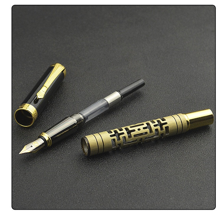 Fountain pen with gold and black design on a dark surface.