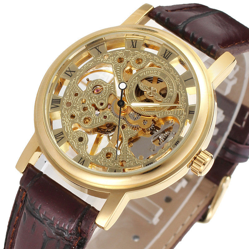 Gold mechanical watch with brown leather strap on white background.