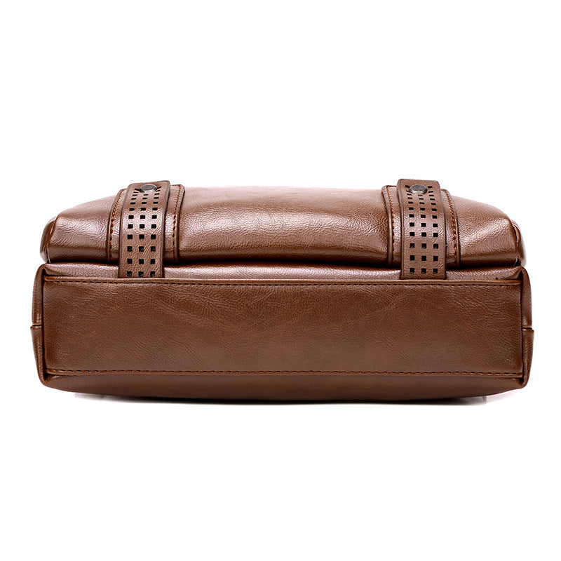 Khaki leather clutch bag with decorative straps on white background.