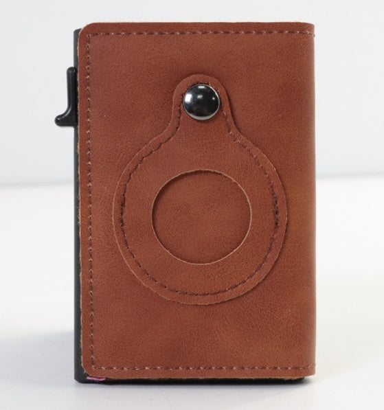 Leather smart cardholder with a circular design on white background.