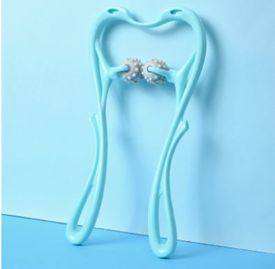 Light blue tooth-shaped holder with earrings on a light blue background.