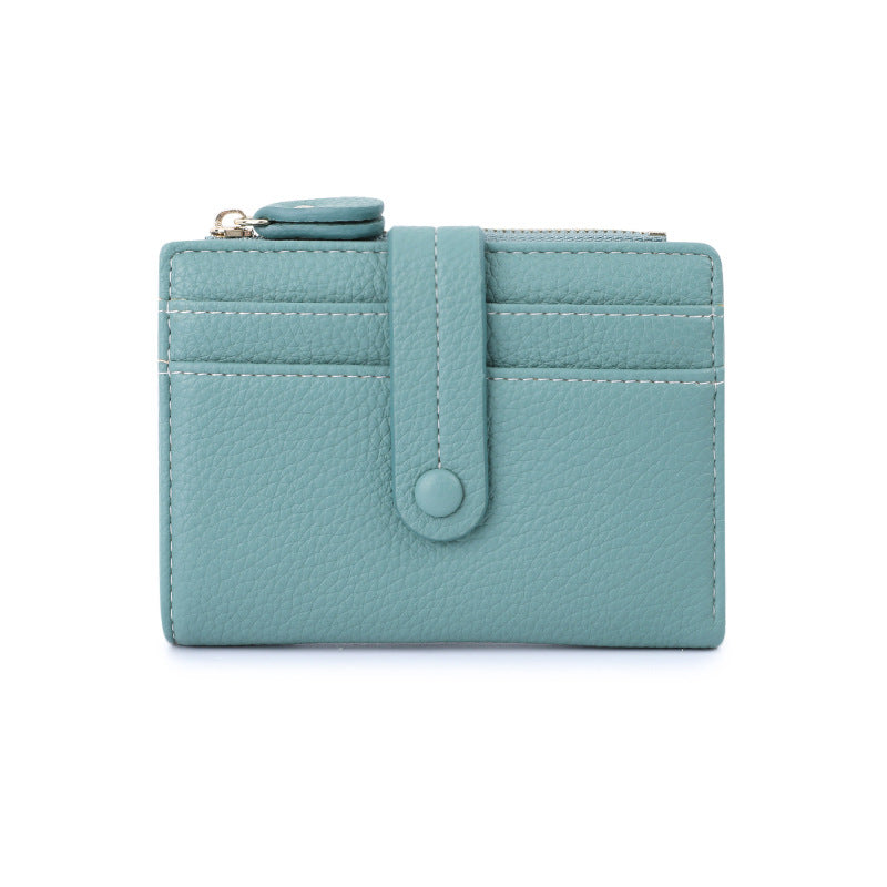Light blue wallet with a strap on a white background.
