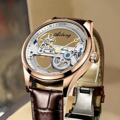 Luxury watch with visible mechanism and brown leather strap on a blurred background.