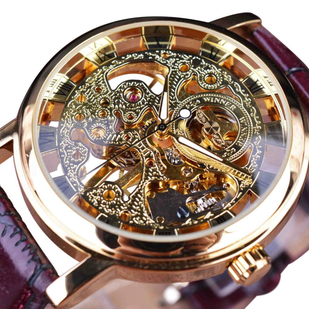 Luxury watch with intricate mechanical design and gold casing on white background.