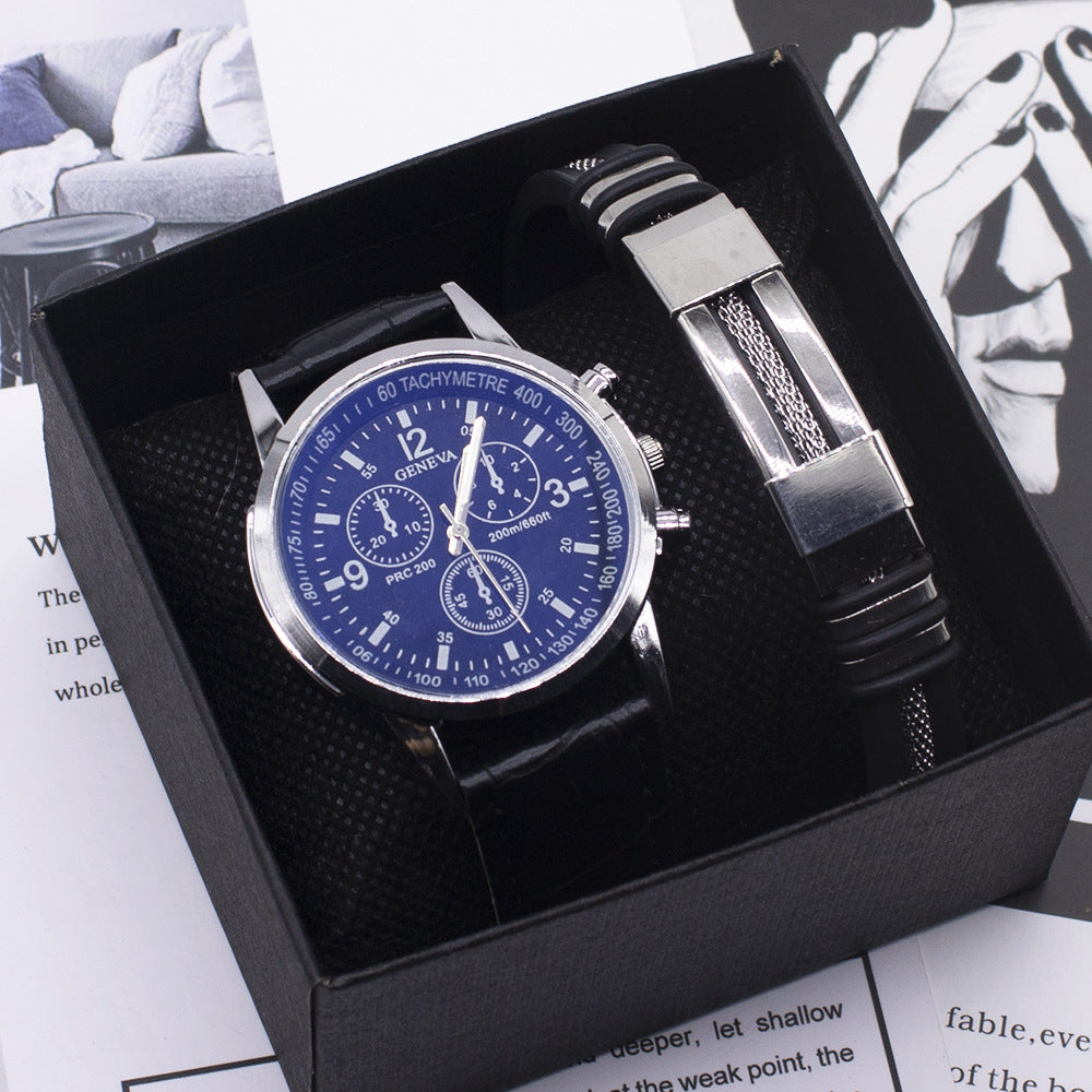 Men´s watch with black leather strap, blue dial and silver bracelet in a black box.
