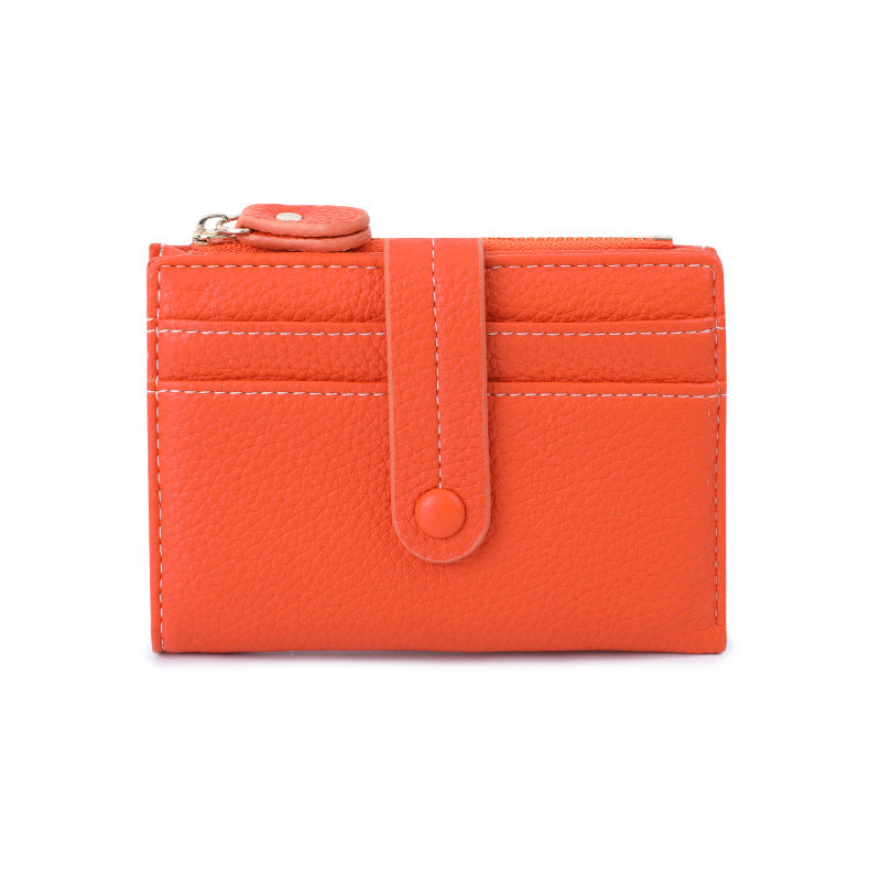 Orange wallet with a strap on a white background.
