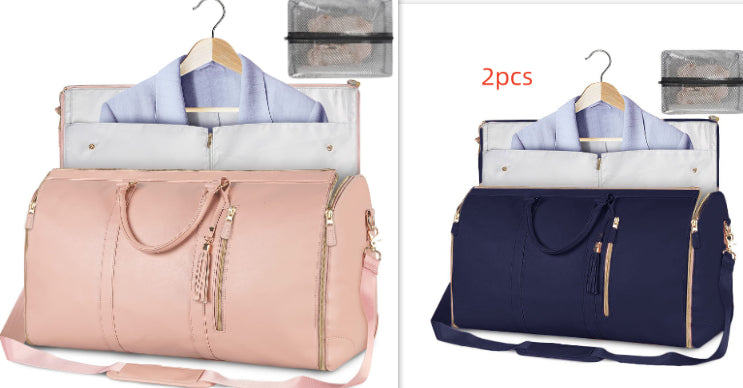 Two duffel bags, one pink and one navy, with hangers and clothes inside on a white background.