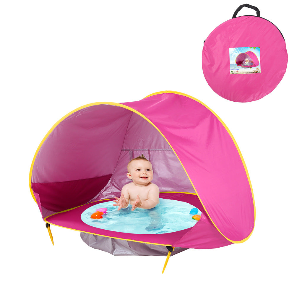 Pink baby pool with canopy and baby playing inside, showing carrying bag.