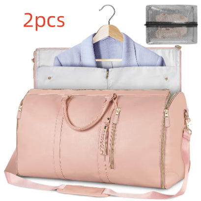 Pink duffel bag with clothes and a hanger, accompanied by a clear travel organizer with «2pcs» text.