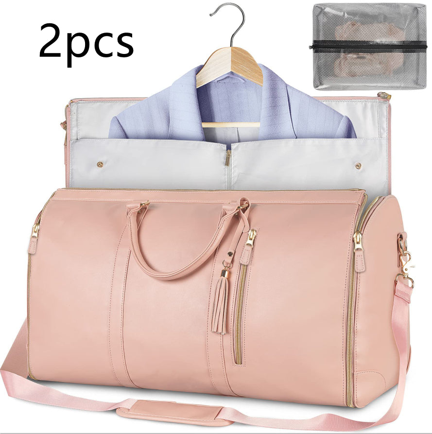 Pink travel bag with a hanger and garment bag on a white background