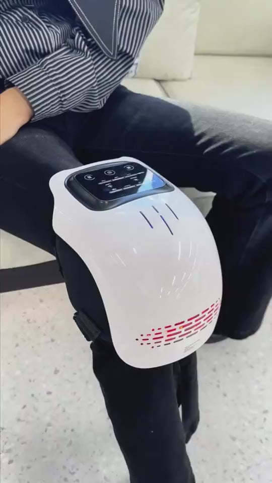 Woman using a knee massager on her knee, demonstrating heat therapy, vibration massage, and red light therapy to help relieve knee pain, improve circulation, and reduce discomfort.