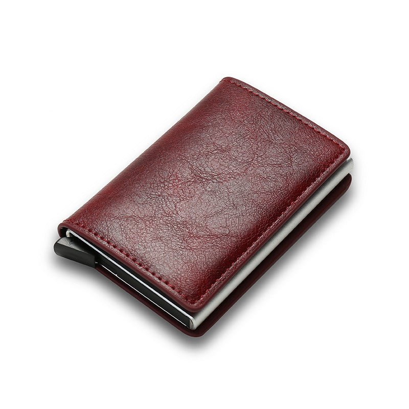 Red leather smart cardholder with metal clip on white background.
