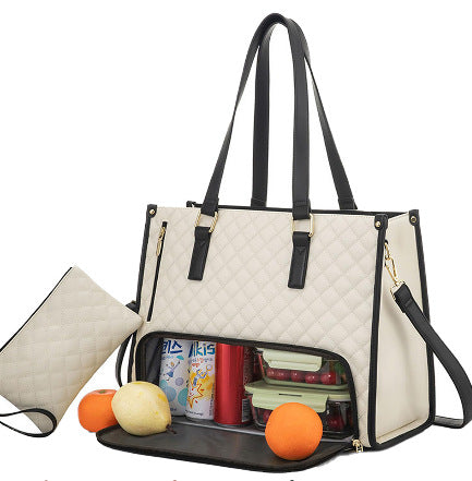 White quilted handbag with black strps, open to reveal its contents on a white background.
