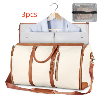 White travel bag with brown handles and trim, open to reveal clothes and a hanger, with «3pcs» text above.