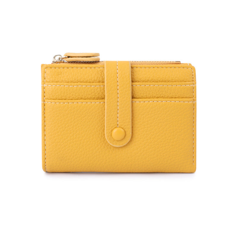Yellow wallet with a strap on a white background.